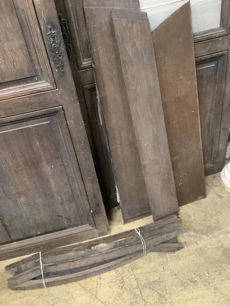 A pair of 18th century French oak armoire doors, width 150cm